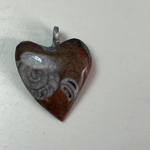 Pd12. Small heart shaped stone pendant with fossil.